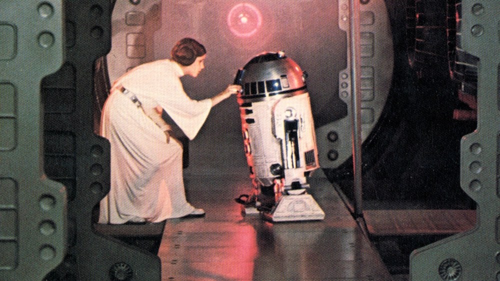 Carrie Fisher e R2-D2 nel primo 'Guerre stellari' – Foto: PHOTO12 - ARCHIVES DU 7EME ART