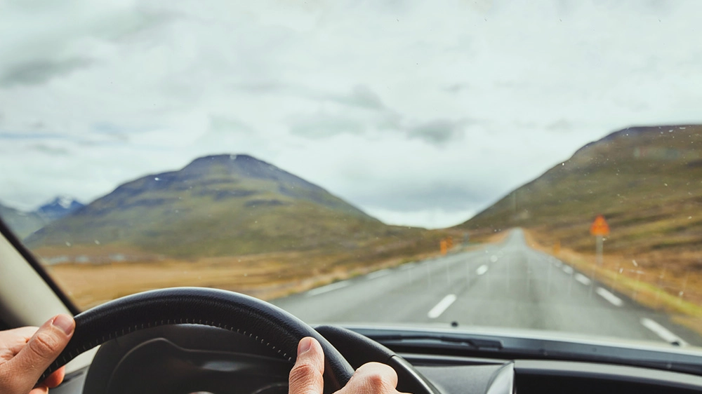 Travel to Iceland, driving car on a beautiful scenic road.