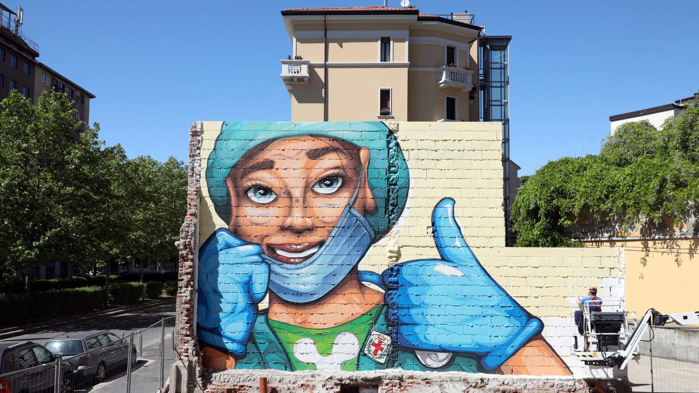 Coronavirus, un murales 'ottimista' sul'andamento della pandemia (Ansa)