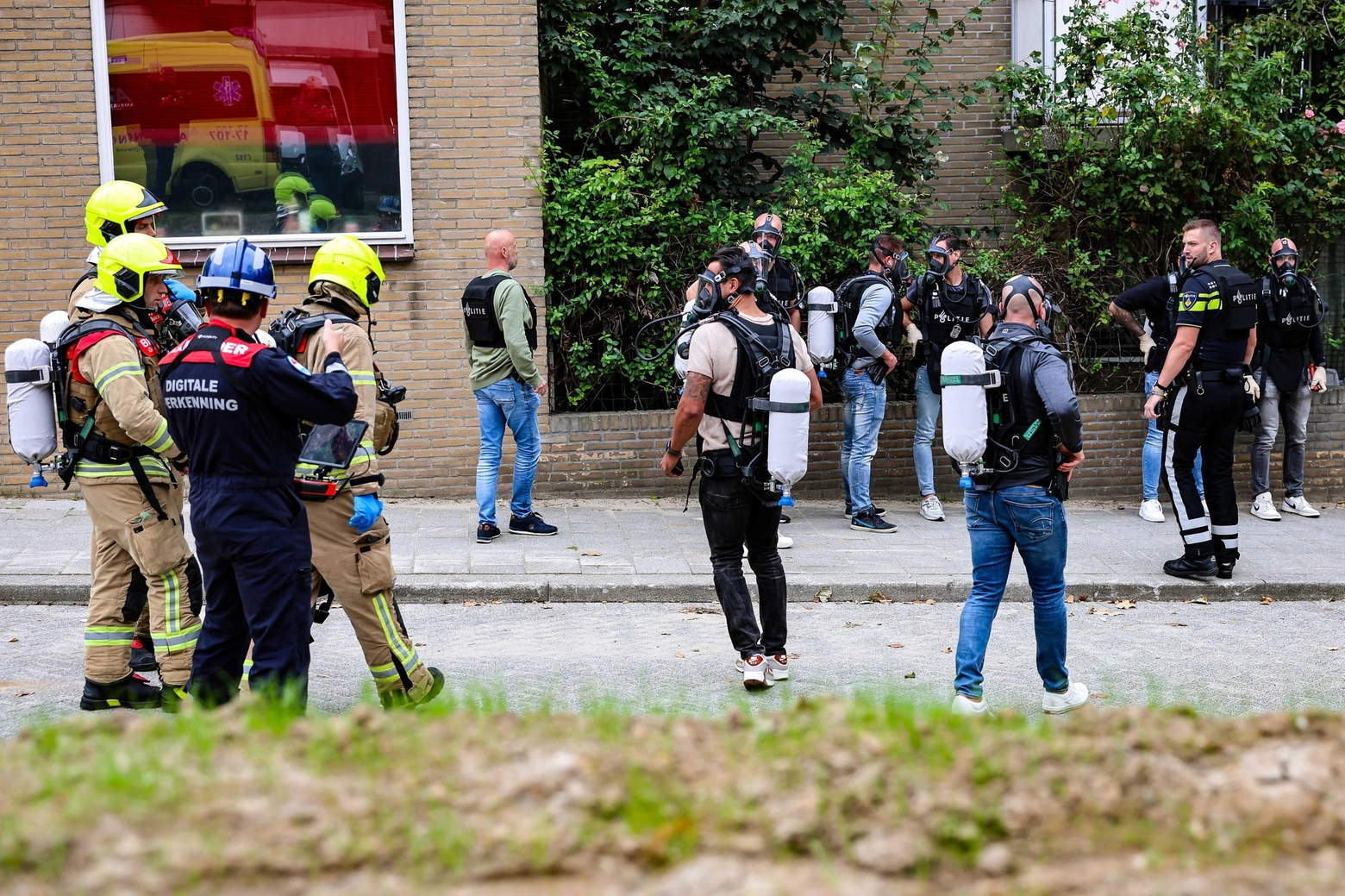 epa10888203 Special units of the police and fire brigade work at the scene of a fire in a building on Heiman Dullaertplein in Rotterdam, Netherlands, 28 September 2023. There have been two shooting incidents in Rotterdam that injured two people: at a house on Heiman Dullaertplein in West, and in a classroom at the Erasmus Medical Center. 
An unknown person wearing combat clothing shot at people first in an apartment and after in the hospital, the police announced. A suspect has been arrested.  EPA/Marco van der Caaij