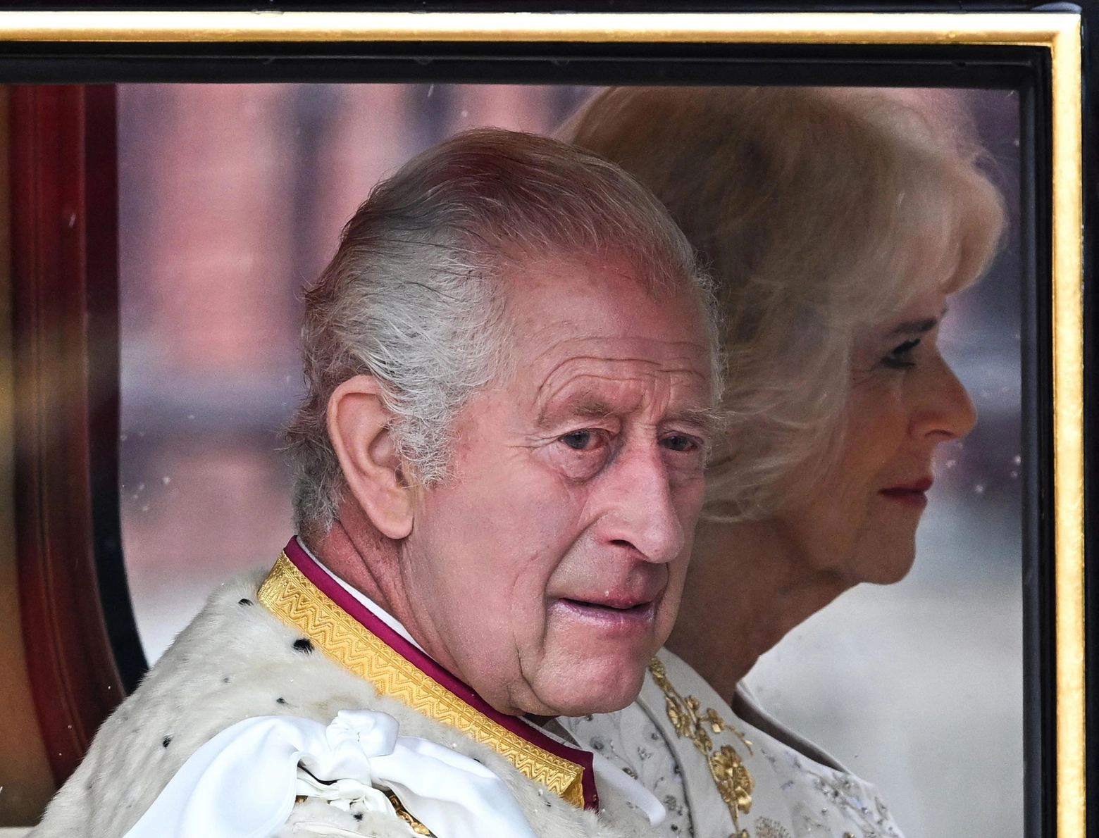 Britain's King Charles III and Britain's Camilla, Queen Consort begin their journey in the Diamond Jubilee State Coach, in the 'King's Procession', a journey of two kilometres from Buckingham Palace to Westminster Abbey in central London on May 6, 2023, ahead of their coronations. - The set-piece coronation is the first in Britain in 70 years, and only the second in history to be televised. Charles will be the 40th reigning monarch to be crowned at the central London church since King William I in 1066. Outside the UK, he is also king of 14 other Commonwealth countries, including Australia, Canada and New Zealand. Camilla, his second wife, will be crowned queen alongside him and be known as Queen Camilla after the ceremony. (Photo by Oli SCARFF / AFP)