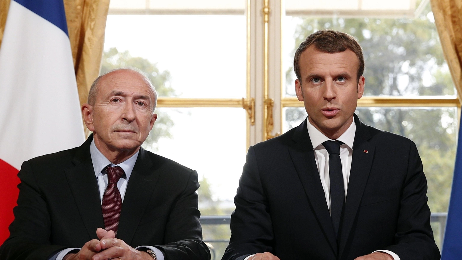 Il ministro dell'Interno Collomb e Emmanuel Macron (Ansa)