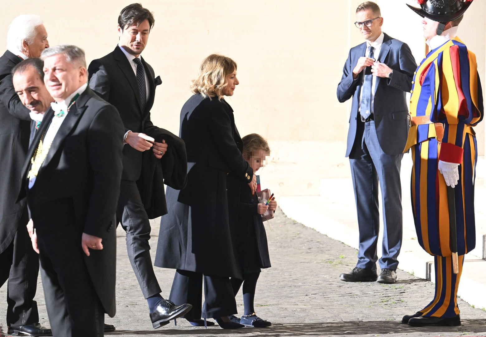 Ginevra, the daughter of Italian Prime Minister, Giorgia Meloni, as she arrives at San Damaso Court with her mother (not in the picture) and his father Andrea Giambruno  (L) for a meeting with Pope Francis at the Vatican, 10 January 2023. ANSA/CLAUDIO PERI