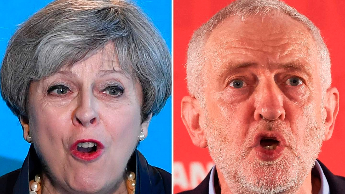 La premier Theresa May e lo sfidante Jeremy Corbyn (Afp)