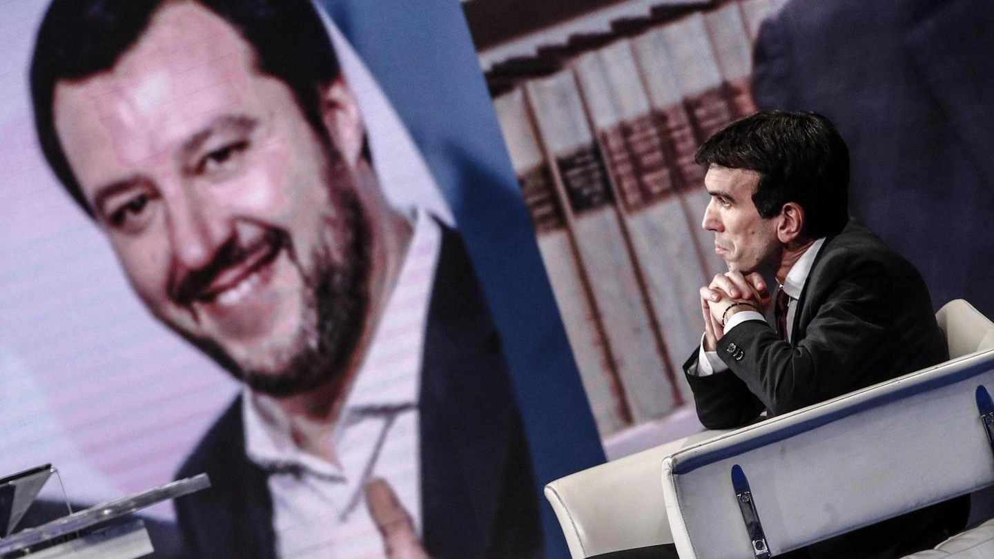 Maurizio Martina a ''Porta a porta''. Dietro, una gigantografia di Salvini (Ansa) 