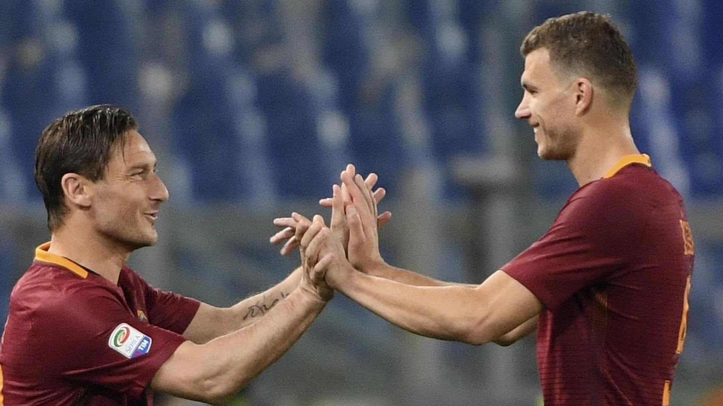 Edin Dzeko e Francesco Totti (Ansa)