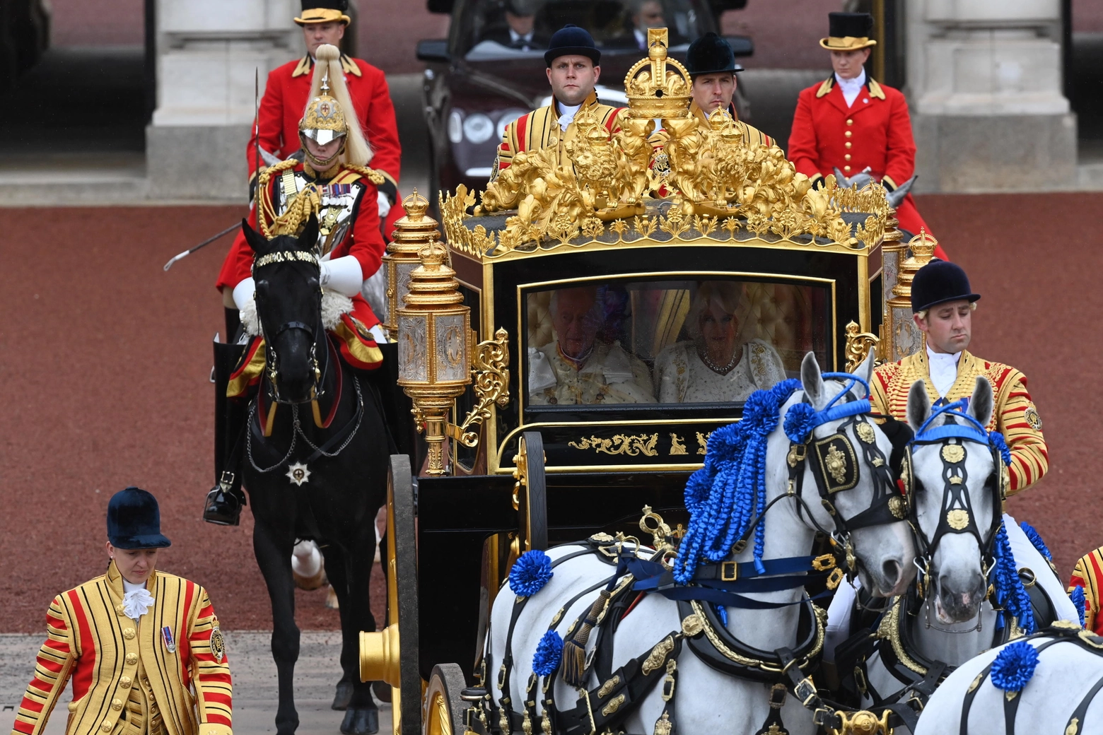 epa10611574 Britain's King Charles III and the Queen Consort Camilla leave Buckingham Palace to Westminster Abbey for their Coronation ceremony in London, Britain, 06 May 2023. The King's Procession in the Diamond Jubilee State coach is accompanied by The Sovereign’s Escort of the Household Cavalry.  EPA/Neil Hall