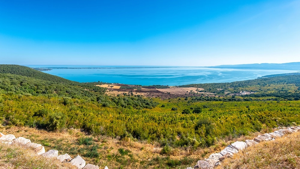 large panoramic of lake Varano in Gargano - Puglia - Italy - at the horizon the adriatic sea