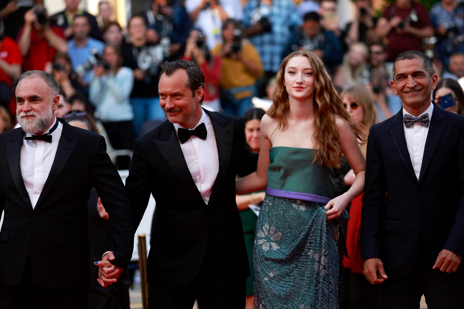 epa10644377 (L-R) Director Karim Ainouz, Jude Law, Junia Rees, and Amr Waked arrive for the screening of 'Le Jeu de la reine' (Firebrand) during the 76th annual Cannes Film Festival, in Cannes, France, 21 May 2023. The movie is presented in the Official Competition of the festival which runs from 16 to 27 May.  EPA/GUILLAUME HORCAJUELO