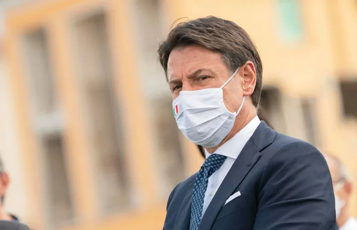 A handout picture made available by the Chigi Palace (Palazzo Chigi) Press Office shows Italian Prime Minister Giuseppe Conte, wearing a protective face mask, attending a mass in memory of the victims of the earthquake occurred 4 years ago in Amatrice, Rieti, Italy 24 August 2020. ANSA//FILIPPO ATTILI PALAZZO CHIGI PRESS OFFICE HANDOUT HANDOUT EDITORIAL USE ONLY/NO SALES