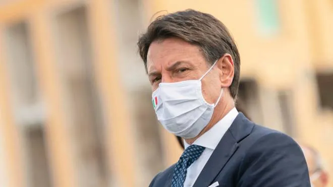 A handout picture made available by the Chigi Palace (Palazzo Chigi) Press Office shows Italian Prime Minister Giuseppe Conte, wearing a protective face mask, attending a mass in memory of the victims of the earthquake occurred 4 years ago in Amatrice, Rieti, Italy 24 August 2020. ANSA//FILIPPO ATTILI PALAZZO CHIGI PRESS OFFICE HANDOUT HANDOUT EDITORIAL USE ONLY/NO SALES