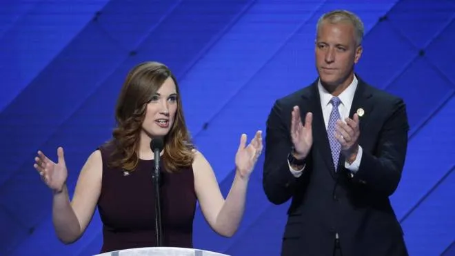 LGBT rights activist and first transgender person to speak at the DNC, Sarah McBride (L), with Co-Chair of the Congressional LGBT Equality Caucus Congressman from New York Sean Patrick Maloney, delivers remarks in the Wells Fargo Center on the final day of the 2016 Democratic National Convention in Philadelphia, Pennsylvania, USA, 28 July 2016. ANSA/SHAWN THEW  EPA/SHAWN THEW