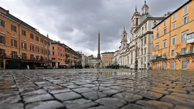 A semi-deserted piazza Navona (Navona square) during pandemic Covid-19 in Rome, Italy, 05 January 2021. Italy is in lockdown over ten days since government restrictions aimed at stopping physical contact during the festive season came into force on 24 December.   ANSA / ETTORE FERRARI