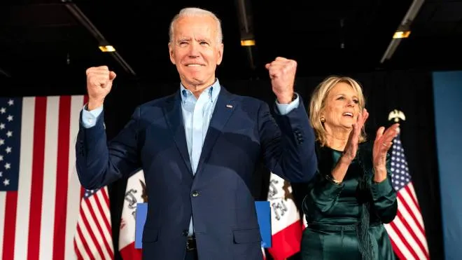 epa08191403 Former Vice President Joe Biden (L), alongside his wife Jill Biden (R), greets supporters during his Iowa caucus night watch party in Des Moines, Iowa, USA, 03 February 2020. The Iowa Caucus is the first in the nation for the 2020 presidential elections.  EPA/JIM LO SCALZO