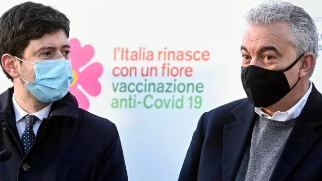 Minister of Health, Roberto Speranza (L), with the Extraordinary Commissioner for the Coronavirus emergency, Domenico Arcuri (R), during the anti-covid vaccine day at the Spallanzani Hospital where the first drugs were symbolically given to five health workers, Rome, Italy, 27 December 2020. ANSA/RICCARDO ANTIMIANI