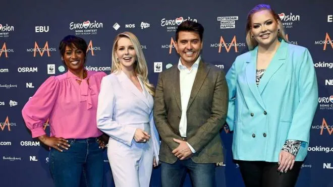 epa09212652 (L-R) Edsilia Rombley, Chantal Janzen, Jan Smit and Nikkie de Jager, presenters of the Eurovision Song Contest attends a press conference during the 65th annual Eurovision Song Contest (ESC) at the Rotterdam Ahoy arena, in Rotterdam, The Netherlands, 19 May 2021. Due to the coronavirus (COVID-19) pandemic, only a limited number of visitors is allowed at the 65th edition of the Eurovision Song Contest (ESC2021) that is taking place in an adapted form at the Rotterdam Ahoy and consist of two semi-finals, on 18 and 20 May, and a grand final on 22 May.  EPA/Patrick van Emst / POOL *** Local Caption *** 50359766