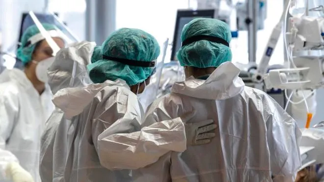 Health workers wearing overalls and protective masks work in the intensive care unit of the GVM ICC hospital of Casal Palocco near Rome during the second wave of the Covid-19 Coronavirus pandemic, Italy, 28 January 2021. ANSA/GIUSEPPE LAMI