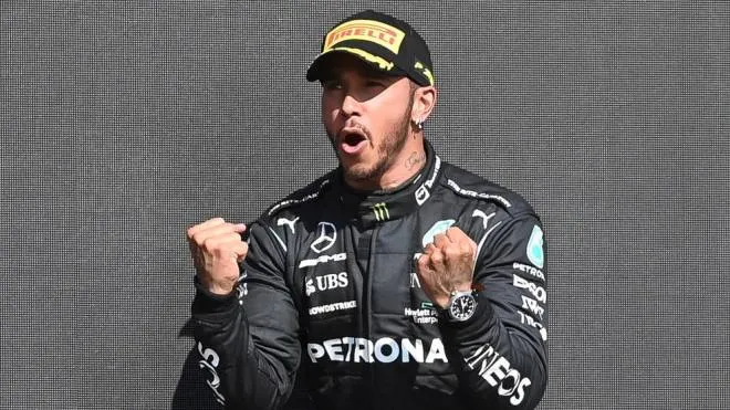 epa09352289 Winner British Formula One driver Lewis Hamilton of Mercedes-AMG Petronas celebrates on the podium after the Formula One Grand Prix of Great Britain at the Silverstone Circuit, in Northamptonshire, Britain, 18 July 2021.  EPA/ANDY RAIN