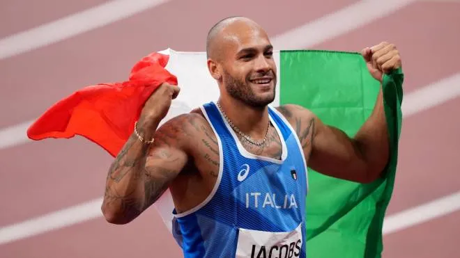 epa09385792 Lamont Marcell Jacobs of Italy celebrates after winning the Men's 100m final during the Athletics events of the Tokyo 2020 Olympic Games at the Olympic Stadium in Tokyo, Japan, 01 August 2021.  EPA/JOE GIDDENS  AUSTRALIA AND NEW ZEALAND OUT