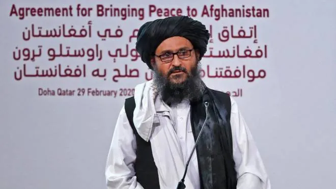 (FILES) In this file photo taken on February 29, 2020 Taliban co-founder Mullah Abdul Ghani Baradar speaks at a signing ceremony of the US-Taliban agreement in the Qatari capital Doha. - The Taliban's deputy leader and co-founder Mullah Abdul Ghani Baradar arrived in Kandahar on August 17, 2021, landing in the insurgent group�s former capital just days after they took control of the country. (Photo by KARIM JAAFAR / AFP)