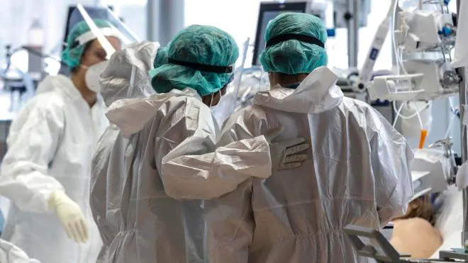 Health workers wearing overalls and protective masks work in the intensive care unit of the GVM ICC hospital of Casal Palocco near Rome during the second wave of the Covid-19 Coronavirus pandemic, Italy, 28 January 2021. ANSA/GIUSEPPE LAMI