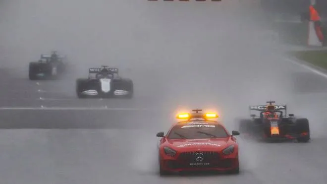 epa09435540 The safety car leads Formula One cars during the Formula One Grand Prix of Belgium at the Spa-Francorchamps race track in Stavelot, Belgium, 29 August 2021. The race was delayed due to heavy rain.  EPA/STEPHANIE LECOCQ