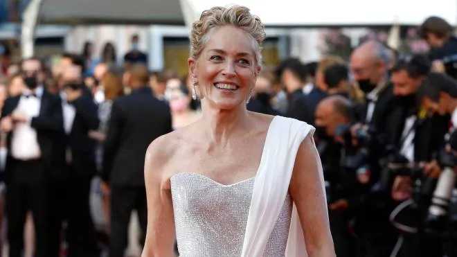 epa09350671 Sharon Stone arrive for the Closing Awards Ceremony of the 74th annual Cannes Film Festival, in Cannes, France, 17 July 2021. The Golden Palm winning movie will be screened after the closing ceremony.  EPA/SEBASTIEN NOGIER