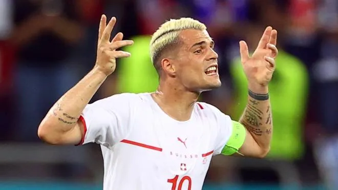 epa09309342 Granit Xhaka of Switzerland reacts during the UEFA EURO 2020 round of 16 soccer match between France and Switzerland in Bucharest, Romania, 28 June 2021.  EPA/Marko Djurica / POOL (RESTRICTIONS: For editorial news reporting purposes only. Images must appear as still images and must not emulate match action video footage. Photographs published in online publications shall have an interval of at least 20 seconds between the posting.)