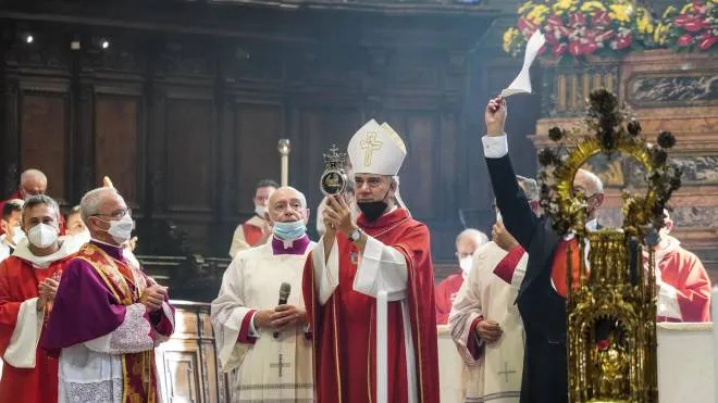 The archbishop of Naples Domenico Battaglia holds a vial said to contain the blood of the 3rd century saint San Gennaro during the so-called liquefaction in the Chapel? of the Treasury, in Naples, Italy, 19 September 2021. ANSA/CESARE ABBATE