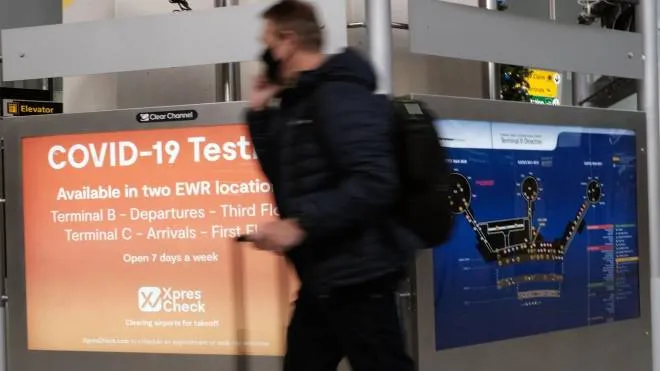 NEWARK, NEW JERSEY - NOVEMBER 30: A COVID-19 testing facility is advertised at Newark Liberty International Airport on November 30, 2021 in Newark, New Jersey. The United States, and a growing list of other countries, has restricted flights from southern African countries due to the detection of the COVID-19 Omicron variant last week in South Africa. Stocks in the travel and airline industry have fallen in recent days as fears grow over the spread and severity of the variant.   Spencer Platt/Getty Images/AFP
== FOR NEWSPAPERS, INTERNET, TELCOS & TELEVISION USE ONLY ==