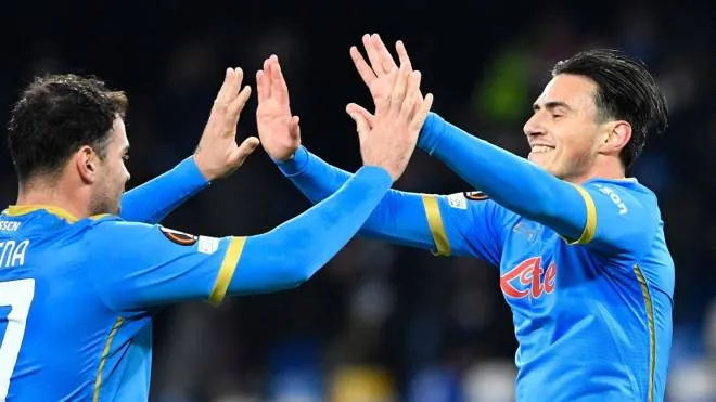 Napoli's Macedonian midfielder Eljif Elmas (R) celebrates with Napoli's Italian forward Andrea Petagna after scoring  during the UEFA Europa League Group C football match between Napoli and Leicester on December 9, 2021 at the Diego-Maradona stadium in Naples. (Photo by Alberto PIZZOLI / AFP)