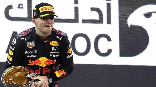 epa09638535 Dutch Formula One driver Max Verstappen of Red Bull Racing celebrates on the podium after winning the 2021 Formula One Grand Prix of Abu Dhabi at Yas Marina Circuit in Abu Dhabi, United Arab Emirates, 12 December 2021.  EPA/Ali Haider