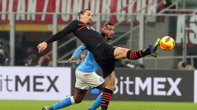 AC Milan�s Zlatan Ibrahimovic (L) challenges for the ball  Napoli�s Juan Jesus during the Italian serie A soccer match between AC Milan and Napoli at Giuseppe Meazza stadium in Milan,  19 December 2021.
ANSA / MATTEO BAZZI