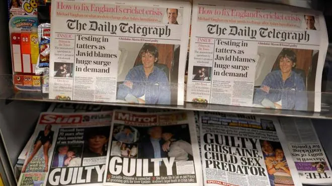 A selection of headlines from British newspapers is pictured in a store in London on December 30, 2021, the morning after a jury in New York found Ghislaine Maxwell guilty of recruiting and grooming young girls to be sexually abused by the late American financier Jeffrey Epstein. - Maxwell, who turned 60 on Christmas Day, was convicted by a 12-person jury of five of the six counts she was facing including the most serious charge of sex trafficking a minor. (Photo by Tolga Akmen / AFP)