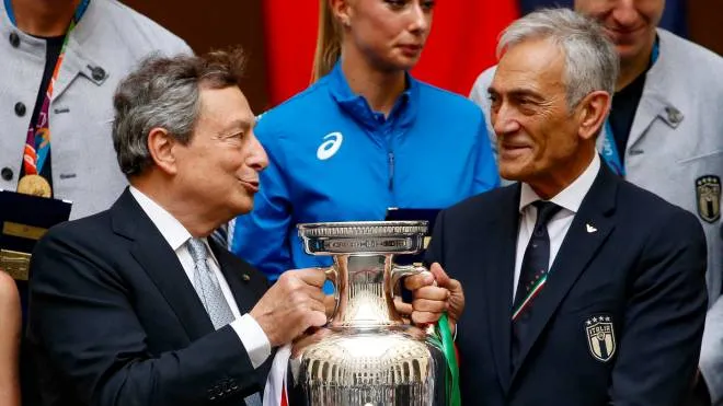 Italy's Prime Minister, Mario Draghi (L) and president of Italian footballa federation (FIGC)  Gabriele Gravina, during a ceremony for players and staff of Italy's national football team at Palazzo Chigi in Rome on July 12, 2021. Italy won the final of UEFA EURO 2020.  ANSA/FABIO FRUSTACI
