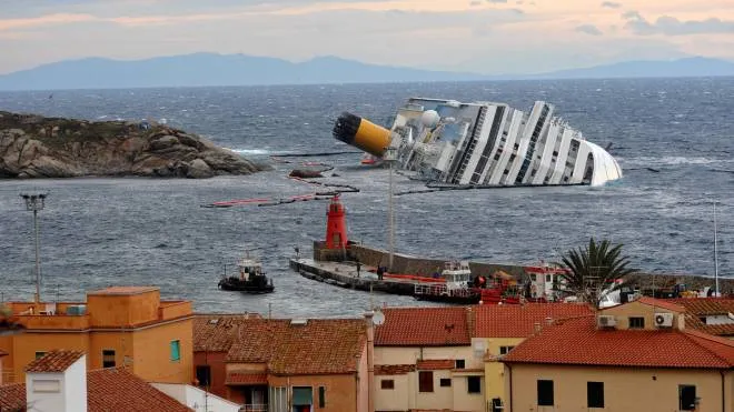 The Costa Concordia ship is lying on the starboard side in front of the small port of Giglio, February 1, 2012. 
ANSA/LUCA ZENNARO