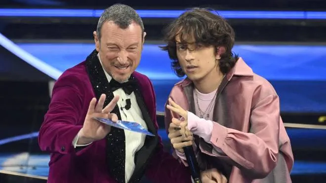 Sanremo Festival host and artistic director, Amadeus (L), and Italian singer Sangiovanni on stage at the Ariston theatre during the 72nd Sanremo Italian Song Festival, Sanremo, Italy, 02 February 2022. The music festival runs from 01 to 05 February 2022.  ANSA/RICCARDO ANTIMIANI