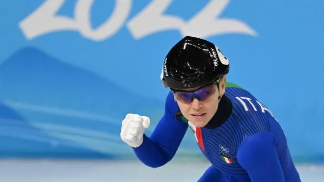 Italy's Arianna Fontana reacts after competing in a semi-final heat of the women's 1500m short track speed skating event during the Beijing 2022 Winter Olympic Games at the Capital Indoor Stadium in Beijing on February 16, 2022. (Photo by Manan VATSYAYANA / AFP)
