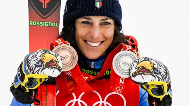 epa09764984 Bronze medalist Federica Brignone of Italy celebrates during the victory ceremony of the women's Alpine Skiing Combined race with the silver medal for the giant slalom at the Beijing 2022 Olympic Games at the Yanqing National Alpine Ski Centre Skiing, Beijing municipality, China, 17 February 2022.  EPA/JEAN-CHRISTOPHE BOTT