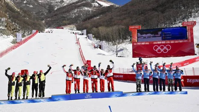 epa09773359 Silver medalist the team of Germany, left, Gold medalist the team of Austria, center, Bronze medalist the team of Norway, right, celebrate during the victory ceremony Alpine Skiing Team Event at the Beijing 2022 Olympic Games at the Yanqing National Alpine Ski Centre Skiing, Beijing municipality, China, 20 February 2022.  EPA/JEAN-CHRISTOPHE BOTT