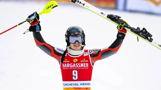 epa09837982 Winner Atle Lie McGrath of Norway celebrates in the finish area during the Men's Slalom race at the FIS Alpine Skiing World Cup finals in Meribel, France, 20 March 2022.  EPA/URS FLUEELER