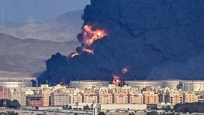 Smoke billows from an oil storage facility in Saudi Arabia's Red Sea coastal city of Jeddah on March 25, 2022. - Yemeni rebels said they attacked a Saudi Aramco oil facility in Jeddah as part of a wave of drone and missile assaults today as a huge cloud of smoke was seen near the Formula One venue in the city. (Photo by ANDREJ ISAKOVIC / AFP)