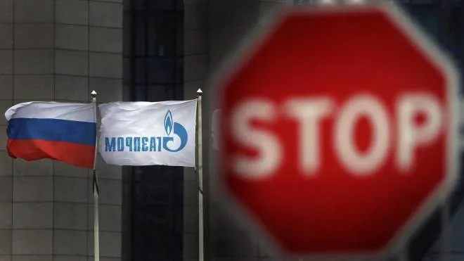 epa08147767 Flags wave outside of the Russian Gazprom company's headquarters in Moscow, Russia, 21 January 2020. According to Gazprom's plans, the Nord Stream 2 natural gas pipeline from Russia to Germany should be completed at the beginning of 2021, despite US sanctions against companies laying pipes for the natural gas pipeline.  EPA/MAXIM SHIPENKOV