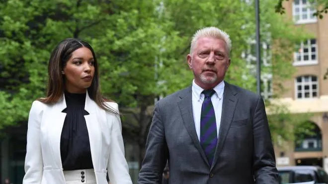 epa09916241 Former tennis champion Boris Becker (R) arrives at Southwark Crown Court with his partner Lilian de Carvalho in London, Britain, 29 April 2022. Becker is due to be sentenced in his bankruptcy trial. The six-time Grand Slam champion is accused of having 'acted dishonestly' when he failed to hand over trophies and medals, including his Wimbledon titles, to pay off his debts, the court heard on 21 March. Becker was declared bankrupt in June 2017.  EPA/ANDY RAIN