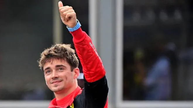 Ferrari's Monegasque driver Charles Leclerc gives the thumbs up as he takes pole position after the qualifying session at the Monaco street circuit in Monaco, ahead of the Monaco Formula 1 Grand Prix, on May 28, 2022. (Photo by ANDREJ ISAKOVIC / AFP)