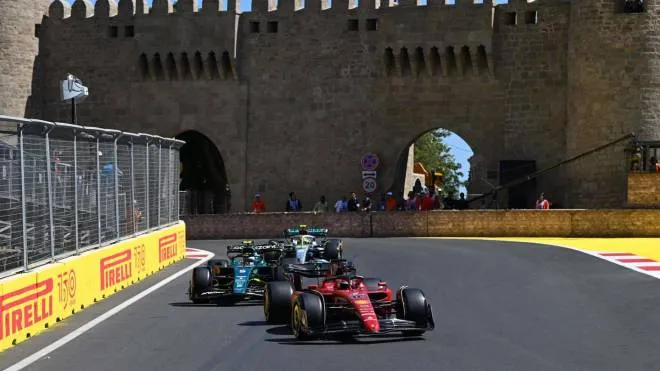 Ferrari's Monegasque driver Charles Leclerc, Aston Martin's German driver Sebastian Vettel and Mercedes' British driver Lewis Hamilton steer their cars during the first practice session ahead of the Formula One Azerbaijan Grand Prix at the Baku City Circuit in Baku on June 10, 2022. (Photo by OZAN KOSE / AFP)