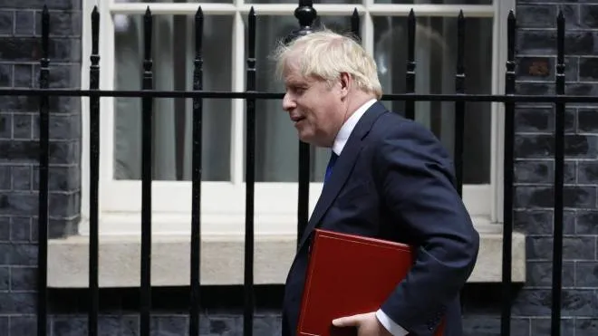 epa10054666 British Prime Minister Boris Johnson leaves 10 Downing Street prior to attending a Prime Minister's Questions (PMQs) session at the Houses of Parliament, in London, Britain, 06 July 2022. British Prime Minister Boris Johnson is facing questions about the future of his premiership following the resignation of two senior government ministers, the Chancellor of the Exchequer and the Health Secretary.  EPA/TOLGA AKMEN