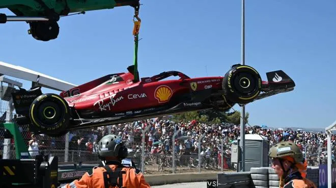The car of Ferrari's Monegasque driver Charles Leclerc is evacuated after he crashed during the French Formula One Grand Prix at the Circuit Paul-Ricard in Le Castellet, southern France, on July 24, 2022. (Photo by CHRISTOPHE SIMON / AFP)