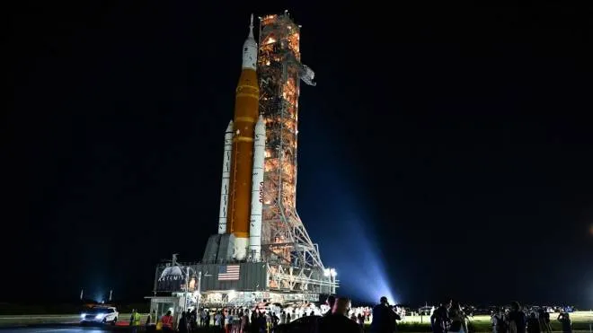 NASA's Artemis I Moon rocket is rolled out to Launch Pad Complex 39B at Kennedy Space Center, in Cape Canaveral, Florida, on August 16, 2022. - Artemis 1, an uncrewed test flight, will feature the first blastoff of the massive Space Launch System (SLS) rocket, which will be the most powerful in the world when it goes into operation. It will propel the Orion crew capsule into orbit around the Moon. The spacecraft will remain in space for 42 days before returning to Earth. (Photo by CHANDAN KHANNA / AFP)
