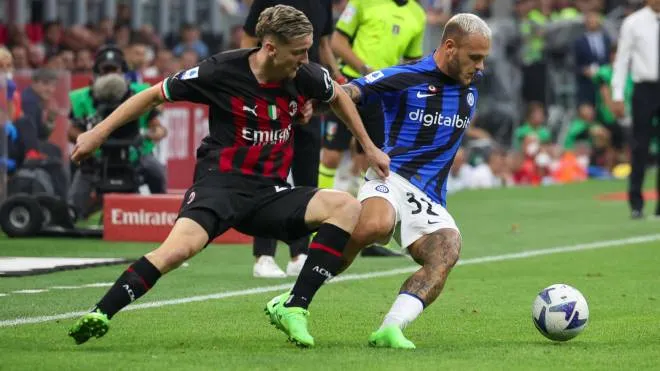 AC Milan's midfielder Alexis Saelemaekers in action against FC Inter Milan's defender Federico Di Marco during the Italian Serie A soccer match between AC Milan and FC Inter Milan at Giuseppe Meazza stadium in Milan, Italy, 3 September 2022. ANSA / ROBERTO BREGANI